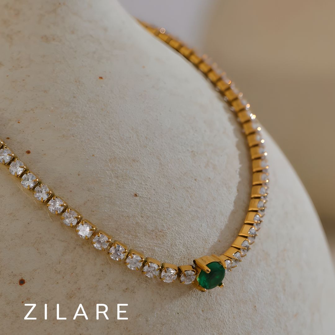 Pulsera dorada con piedras brillantes y detalle verde Florencia