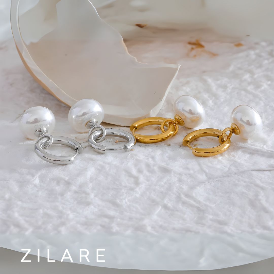 Aretes dorados con perla colgante bañados en oro 18k Paula