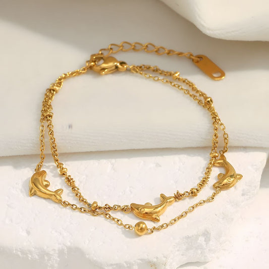 Pulsera dorada doble con delfines baño de oro 18k Paloma
