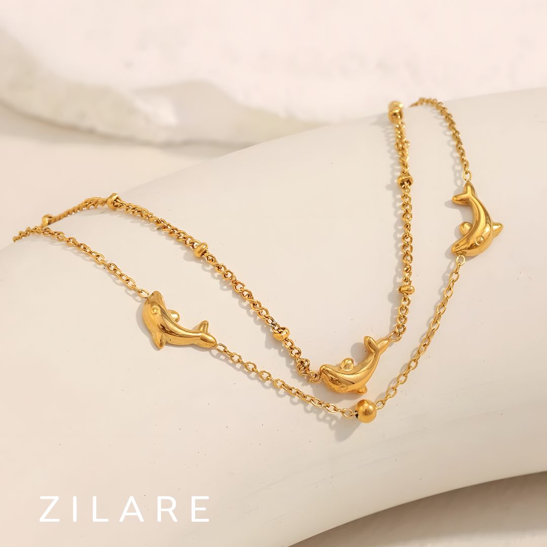 Pulsera dorada doble con delfines baño de oro 18k Paloma
