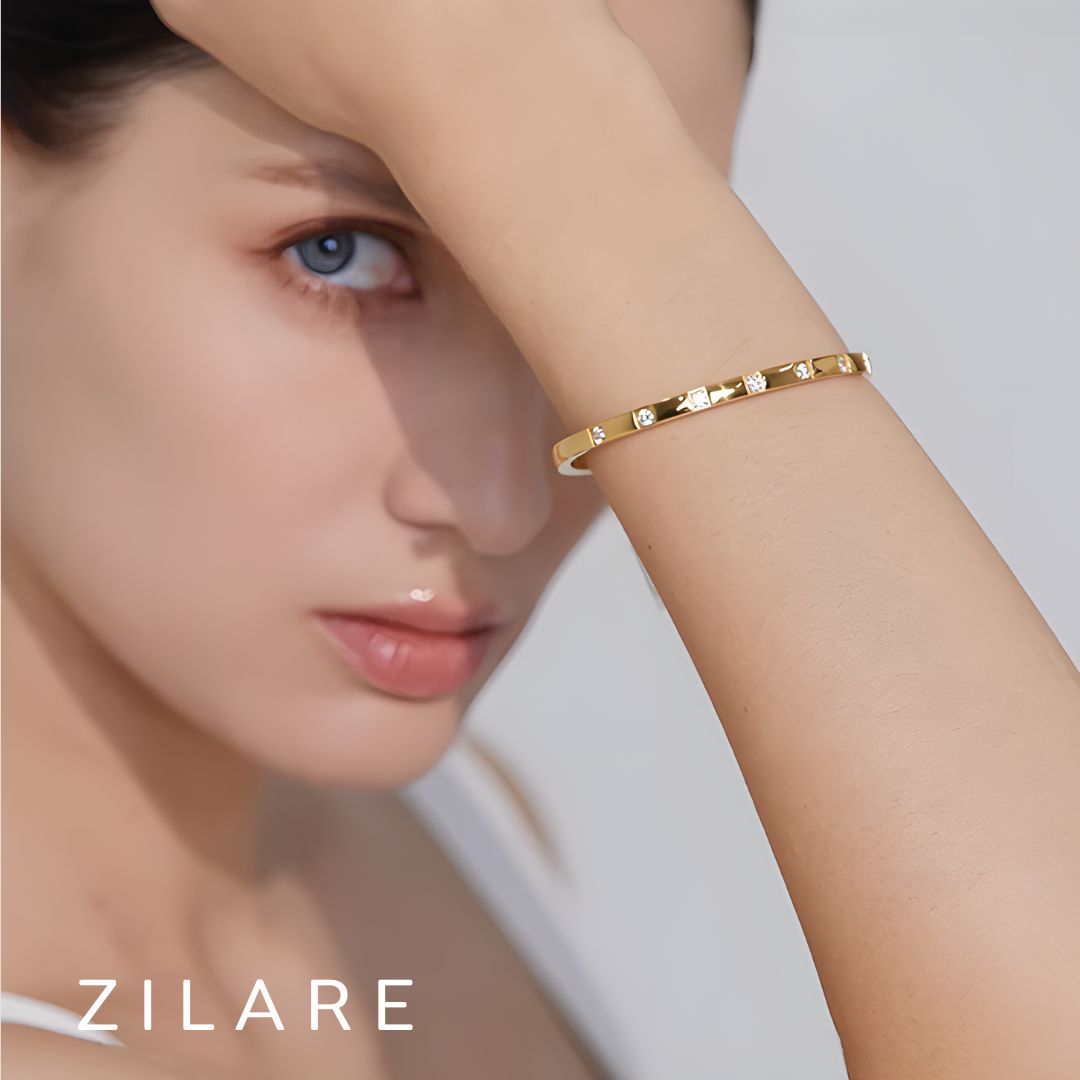 Pulsera dorada con brillos elegantes bañada en oro 18k Nilza