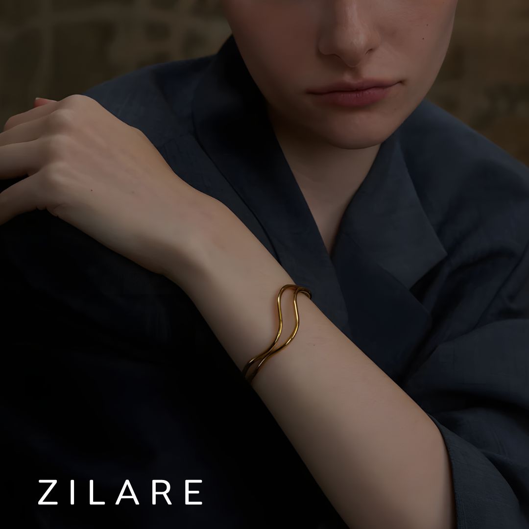 Pulsera dorada líneas dobles curvas bañada en oro 18k Diana