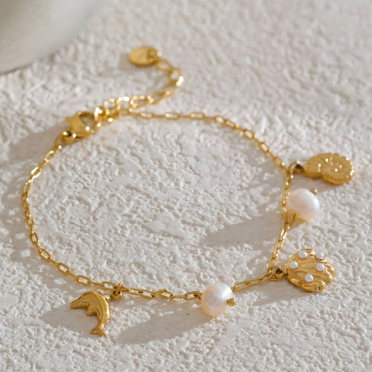 Pulsera dorada marina con dijes bañada en oro 18k Isadora