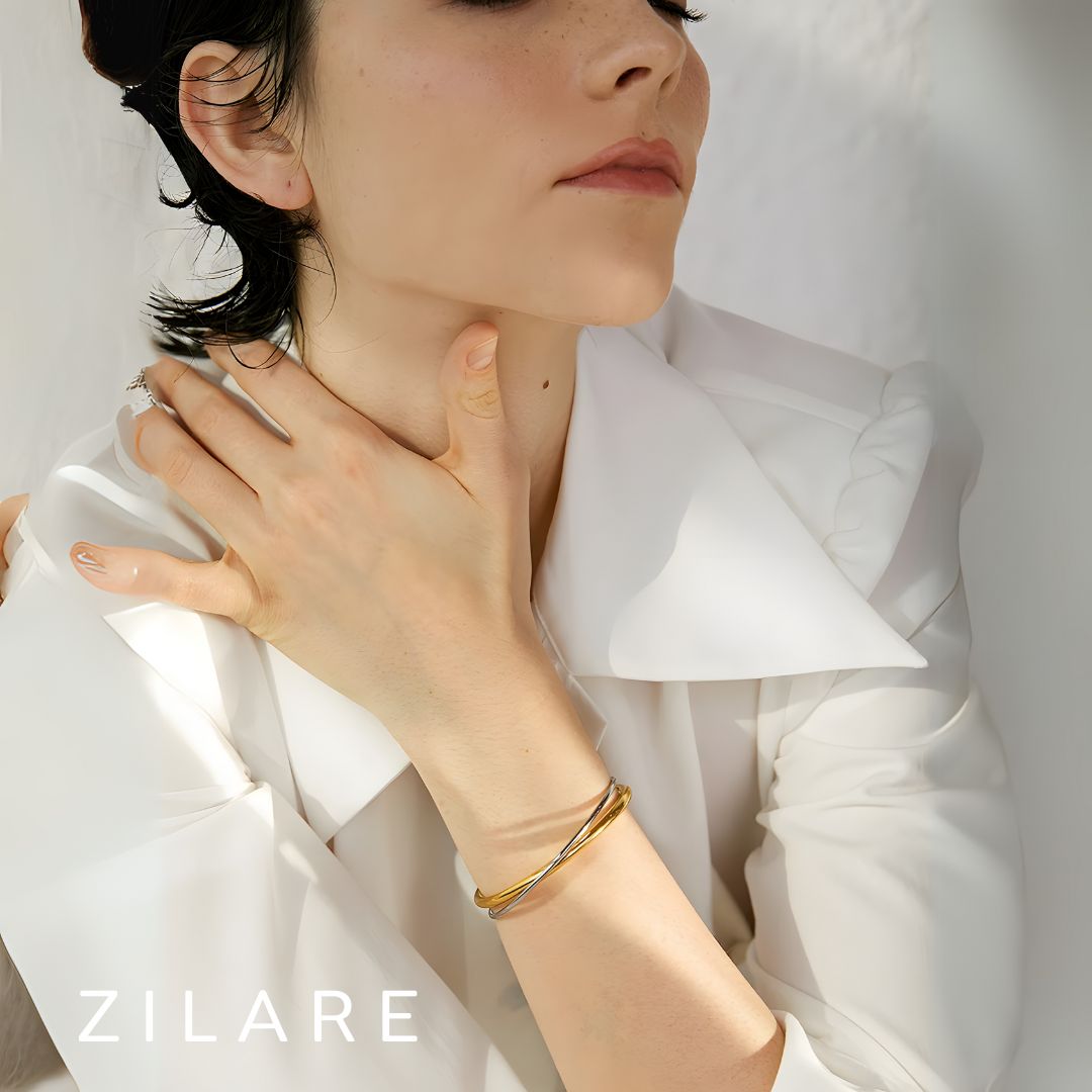 Pulsera Dorada y Plateada Cruzada Bañada en Oro 18k Emilia