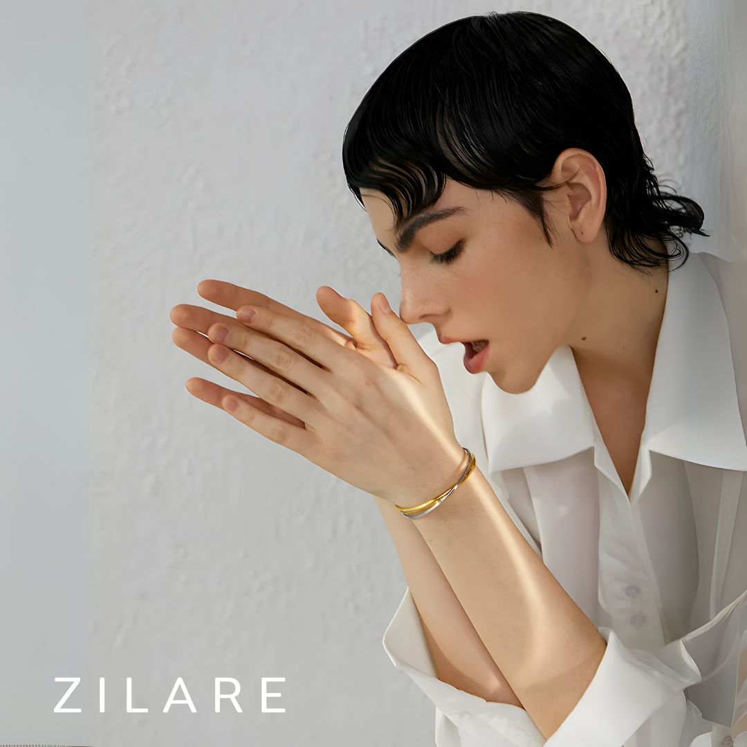 Pulsera Dorada y Plateada Cruzada Bañada en Oro 18k Emilia