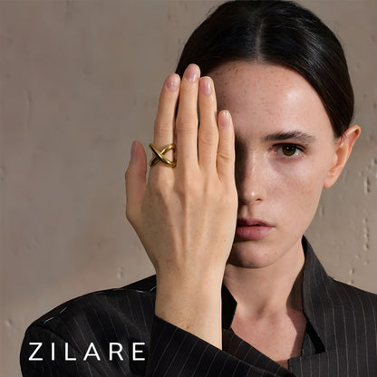 Anillo dorado moderno tipo cruz bañado en oro 18k Renée