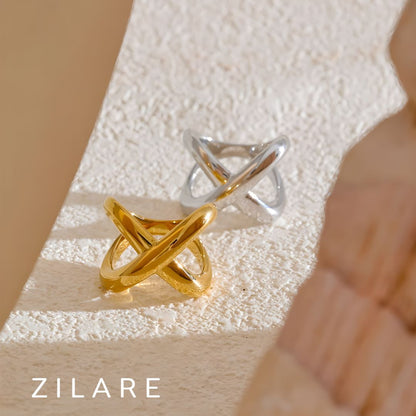 Anillo dorado moderno tipo cruz bañado en oro 18k Renée