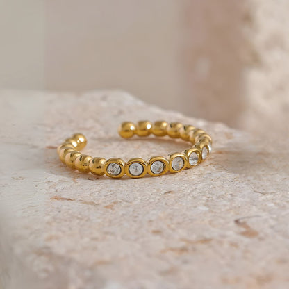 Anillo dorado con zirconias ajustable bañado oro 18k Laura