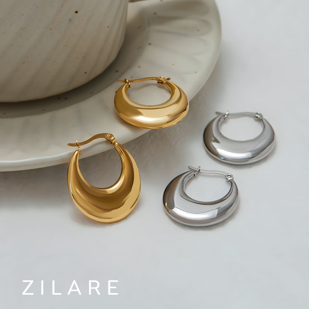 Aretes delicados acero inoxidable con diseño curvo Yamileth