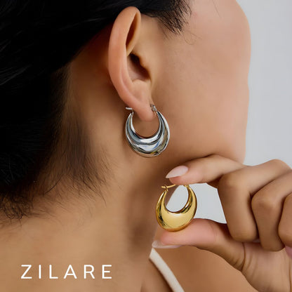 Aretes delicados acero inoxidable con diseño curvo Yamileth