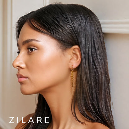 Aretes colgantes dorados con hojas baño de oro 18k Dalía