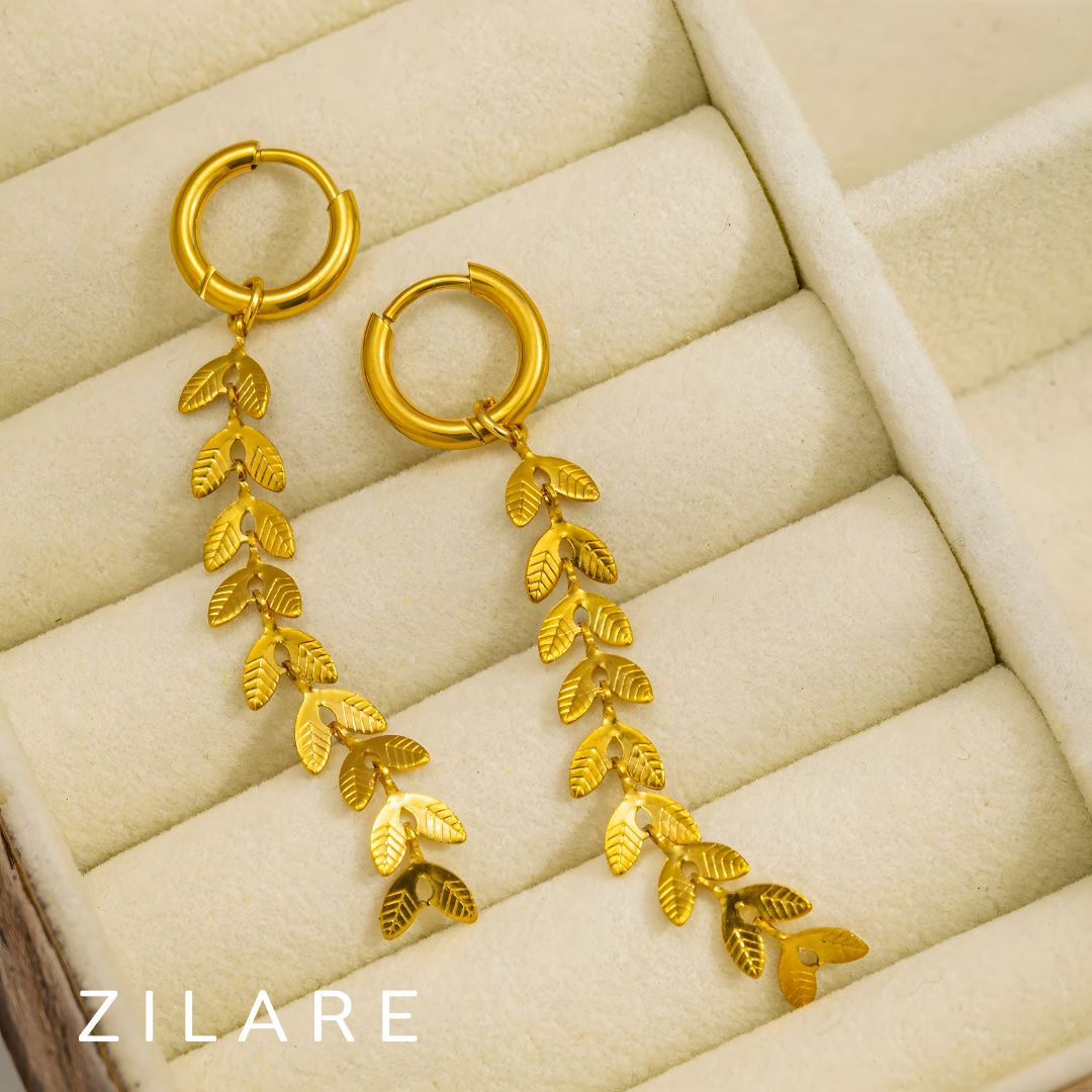 Aretes colgantes dorados con hojas baño de oro 18k Dalía