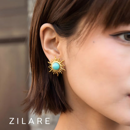 Aretes dorados bañados oro 18k diseño de sol turquesa Xidani