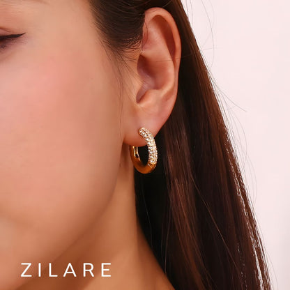 Aretes delicados baño de oro 18k con diseño brillante Marely