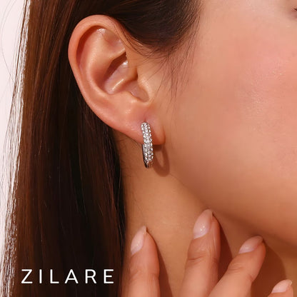 Aretes delicados baño de oro 18k con diseño brillante Marely