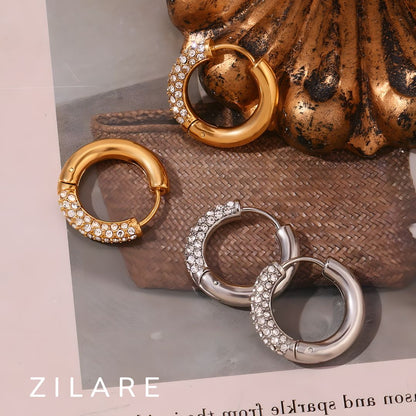 Aretes delicados baño de oro 18k con diseño brillante Marely