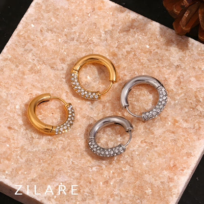 Aretes delicados baño de oro 18k con diseño brillante Marely