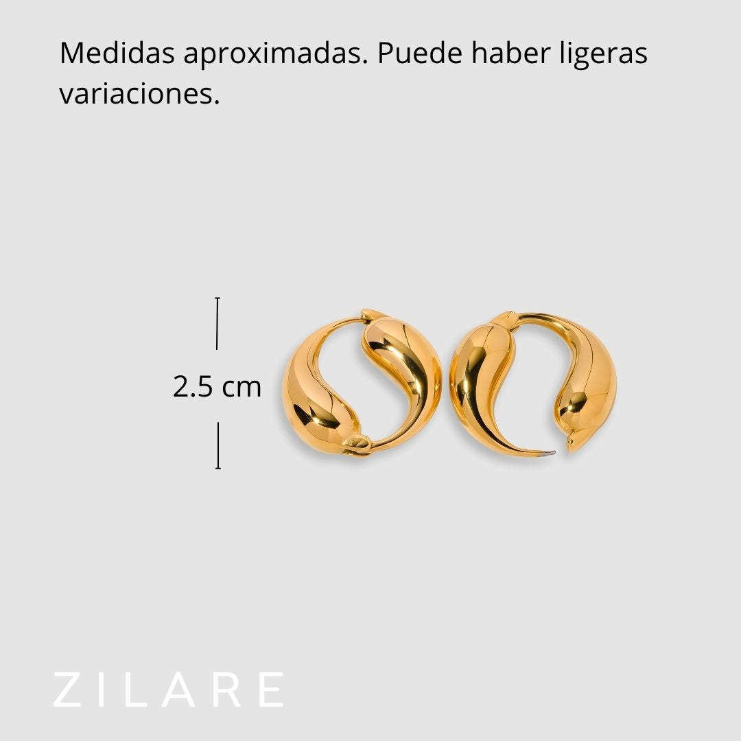 Aretes dorados baño de oro 18k con diseño curvo Marisela
