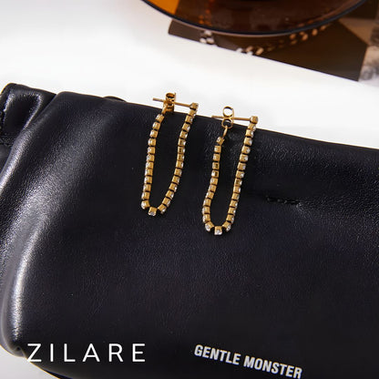 Aretes dorados con brillo elegante bañado en oro 18k Yuridia