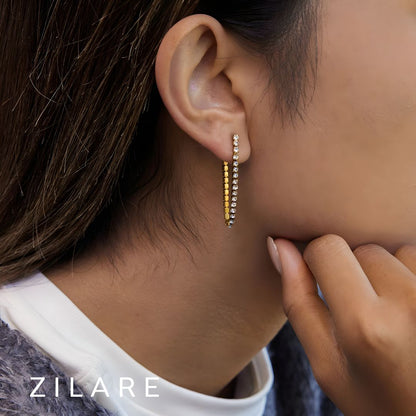 Aretes dorados con brillo elegante bañado en oro 18k Yuridia