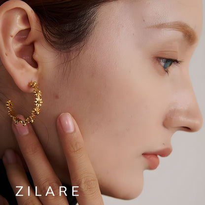 Aretes dorados de flores en aro bañados en oro 18k Bianca