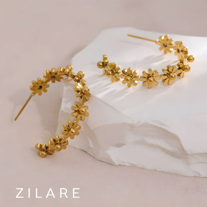 Aretes dorados de flores en aro bañados en oro 18k Bianca