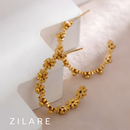 Aretes dorados de flores en aro bañados en oro 18k Bianca