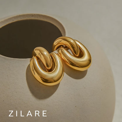 Aretes dorados sofisticado gruesos bañados en oro 18k Flavya