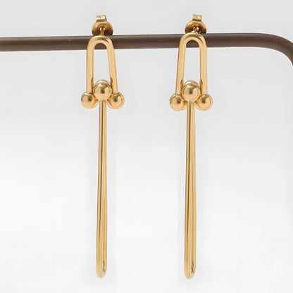 Aretes dorados largos elegantes bañados en oro 18k Adelina