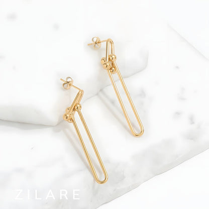 Aretes dorados largos elegantes bañados en oro 18k Adelina