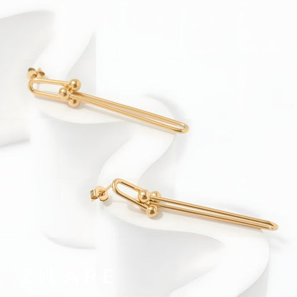 Aretes dorados largos elegantes bañados en oro 18k Adelina