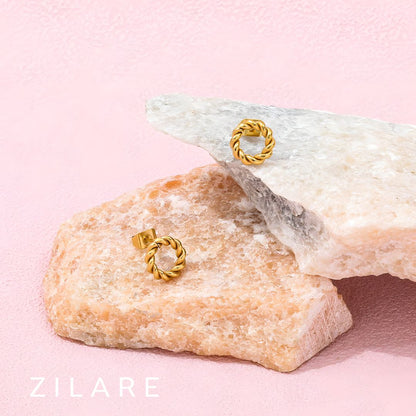 Aretes circulares dorados trenzados baño de oro 18k Mariela