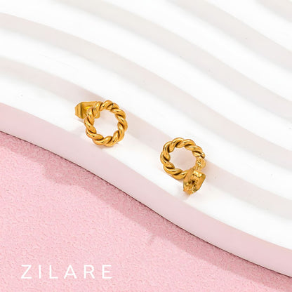 Aretes circulares dorados trenzados baño de oro 18k Mariela