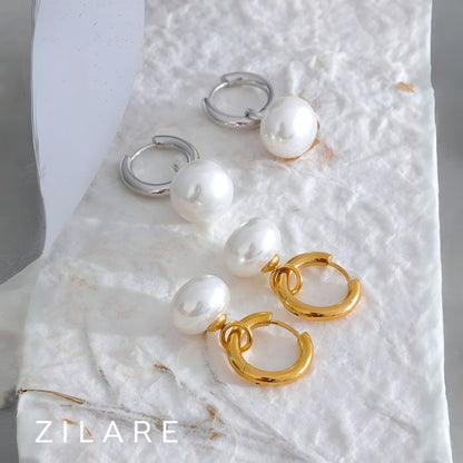 Aretes dorados con perla colgante bañados en oro 18k Paula