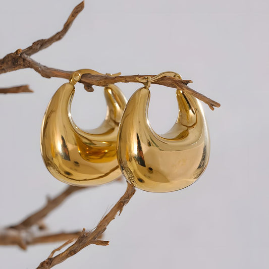 Aretes dorados voluminosos curvos bañados en oro 18k Sofía