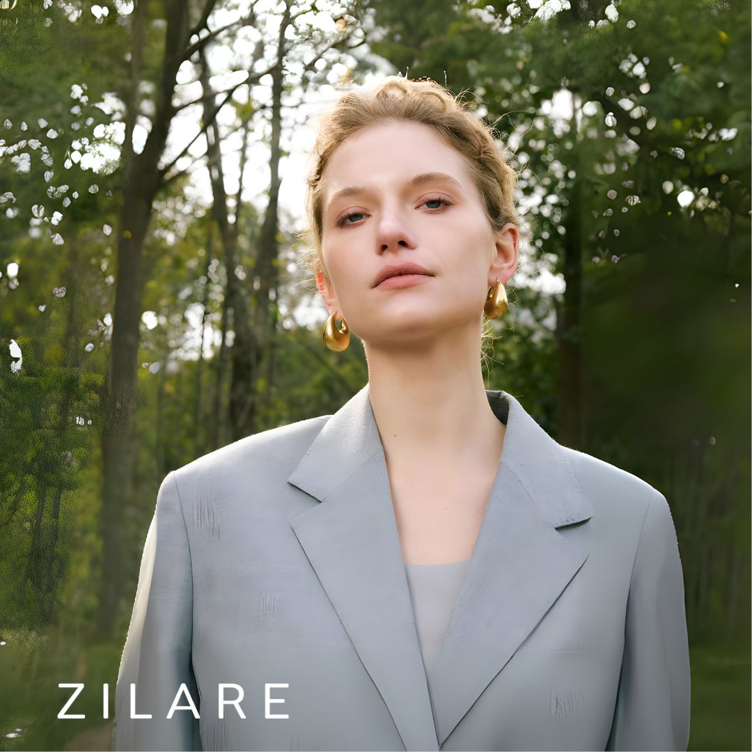 Aretes dorados voluminosos curvos bañados en oro 18k Sofía