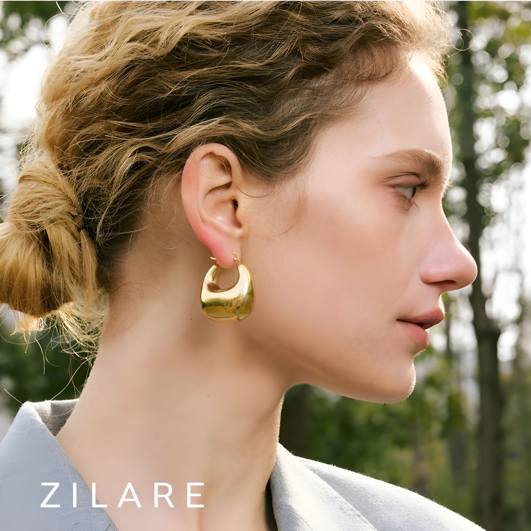 Aretes dorados voluminosos curvos bañados en oro 18k Sofía