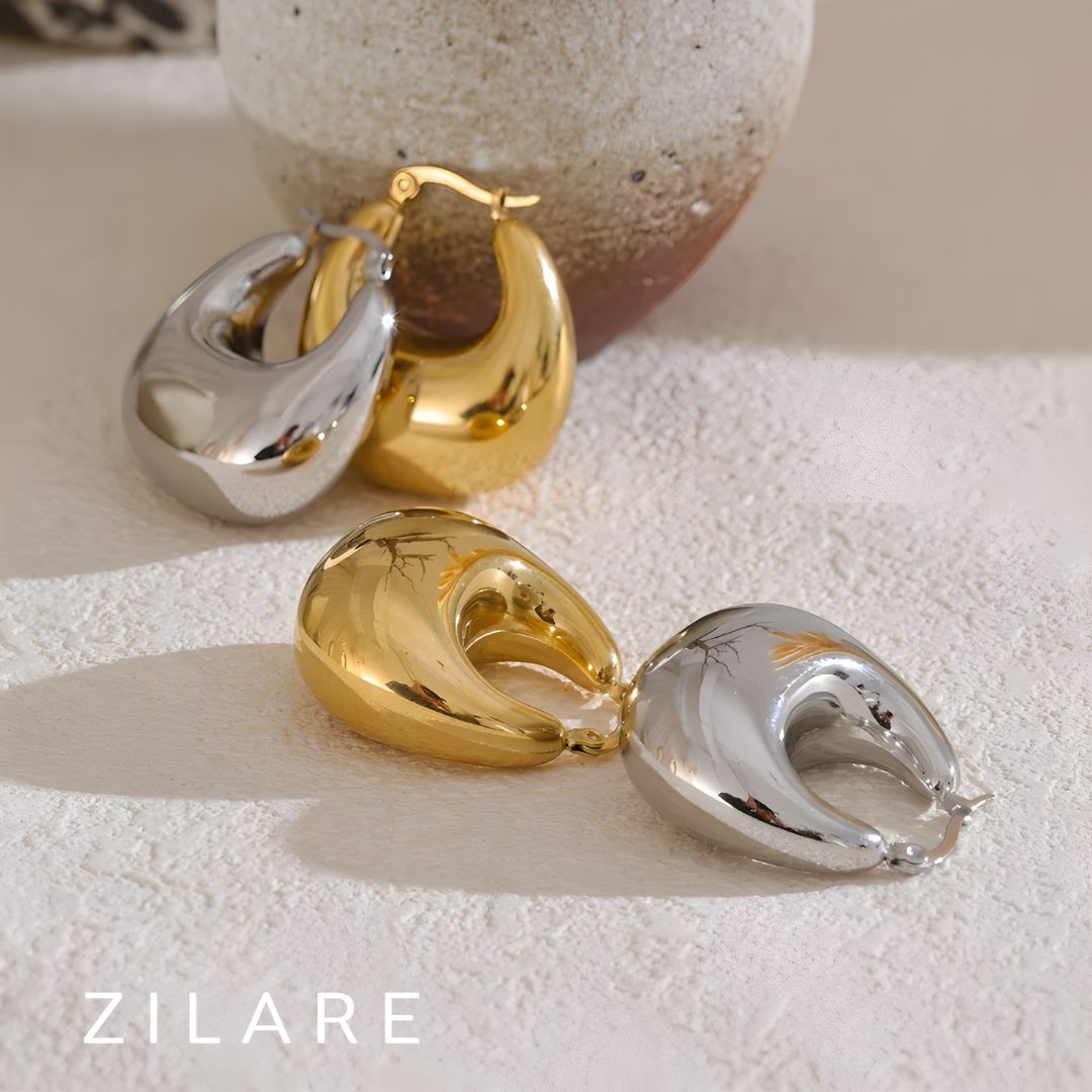 Aretes dorados voluminosos curvos bañados en oro 18k Sofía