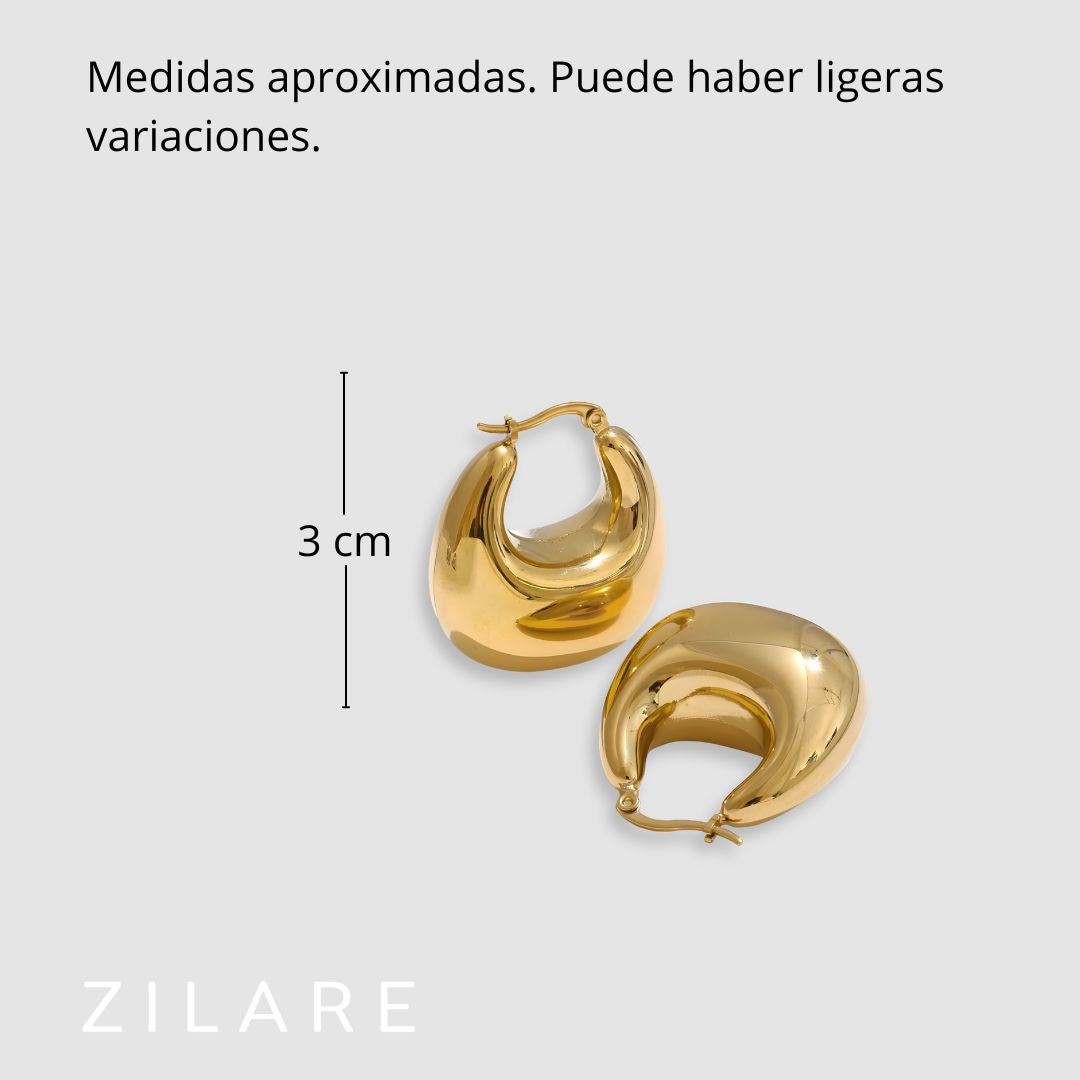 Aretes dorados voluminosos curvos bañados en oro 18k Sofía