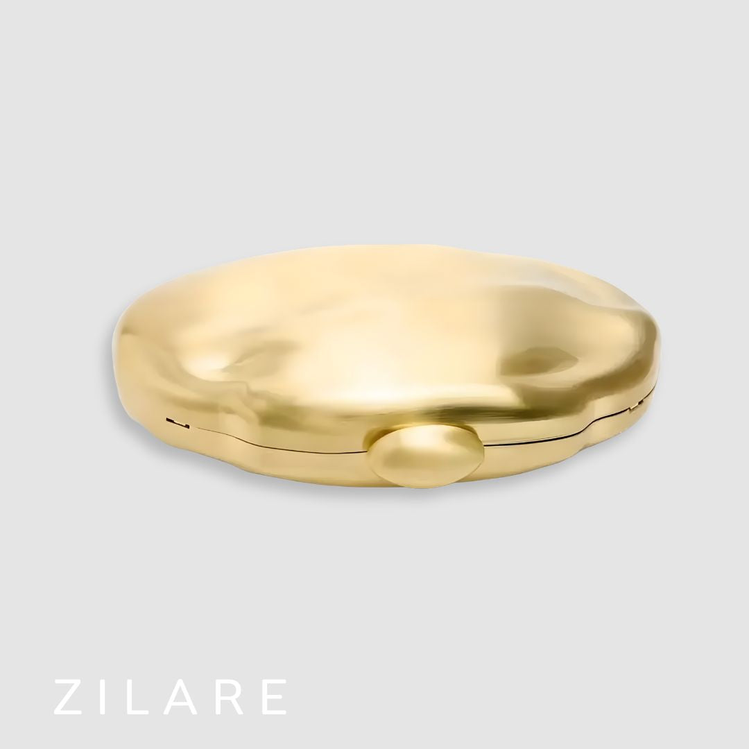 Bolsa de mano mujer dorada con cadena y diseño rígido Dora