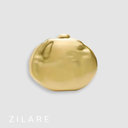 Bolsa de mano mujer dorada con cadena y diseño rígido Dora