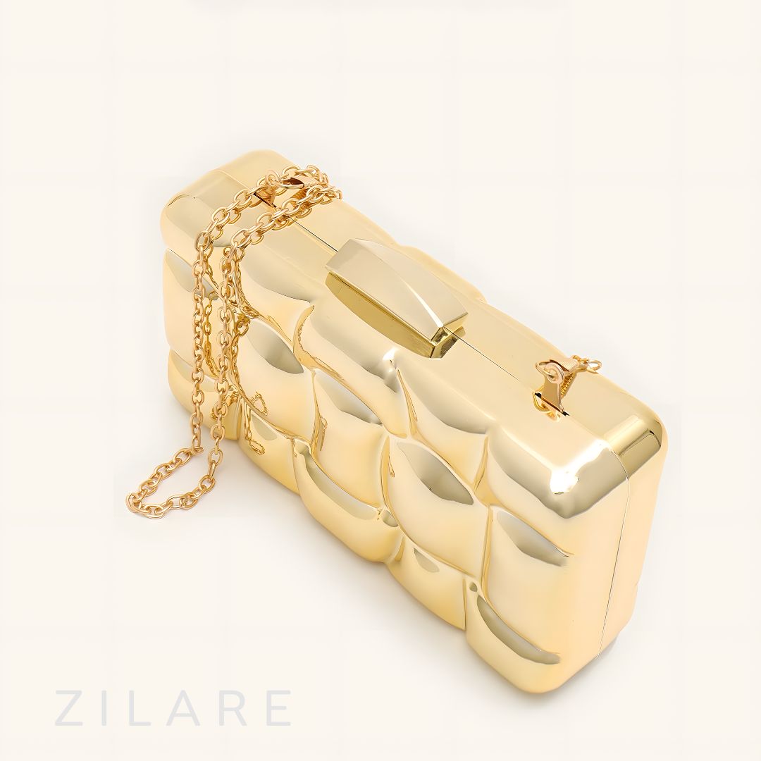 Bolsa de mano para mujer dorada con diseño texturizado Zyra