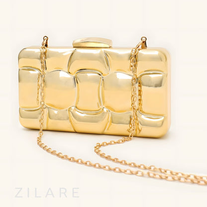 Bolsa de mano para mujer dorada con diseño texturizado Zyra