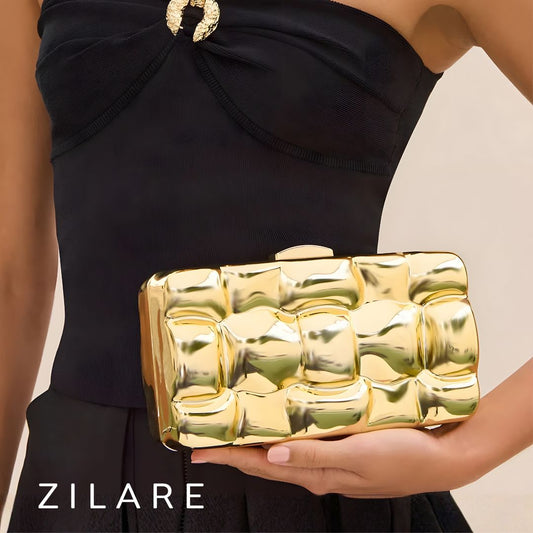 Bolsa de mano para mujer dorada con diseño texturizado Zyra