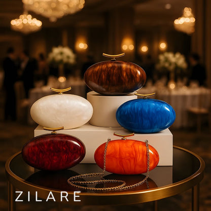 Bolsa de mano marfil nacarado con cierre dorado Marbella