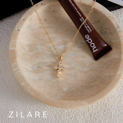 Collar delicado baño de oro 18k con cruz radiante Daila
