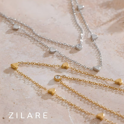 Collar doble con corazones y brillante bañado en oro 18k Isis