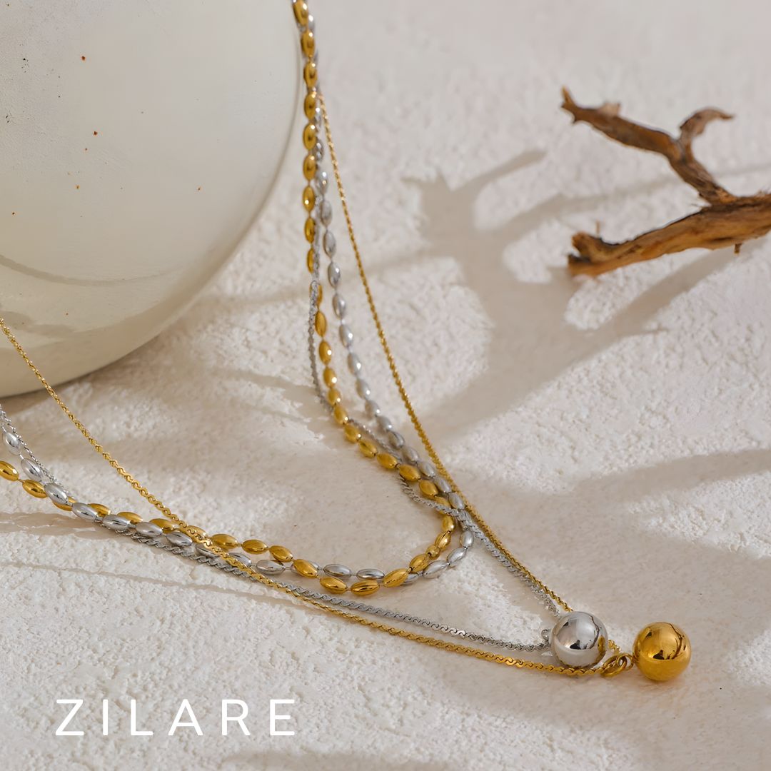 Collar doble bañado en oro 18k con esfera colgante Roxana