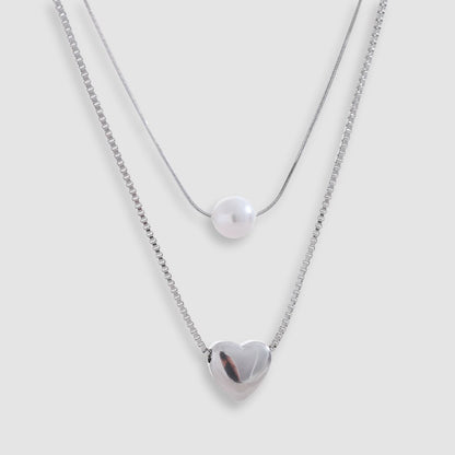 Collar dorado bañado en oro 18k con perla y corazón Leonor