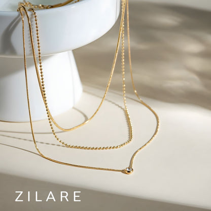 Collar delicado baño de oro 18k con tres cadenas Celina